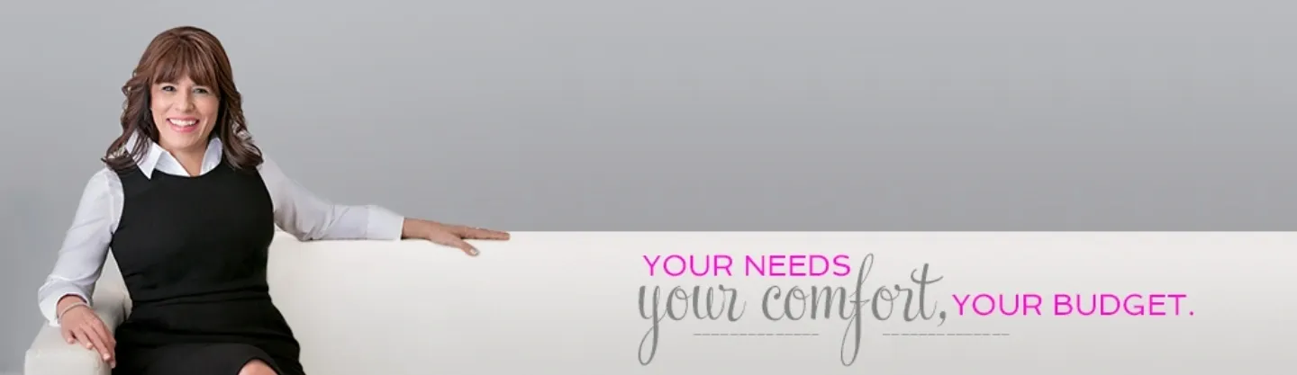 A person is holding onto the side of a white board.
