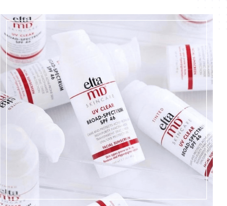 A group of bottles with different types of skin care products.